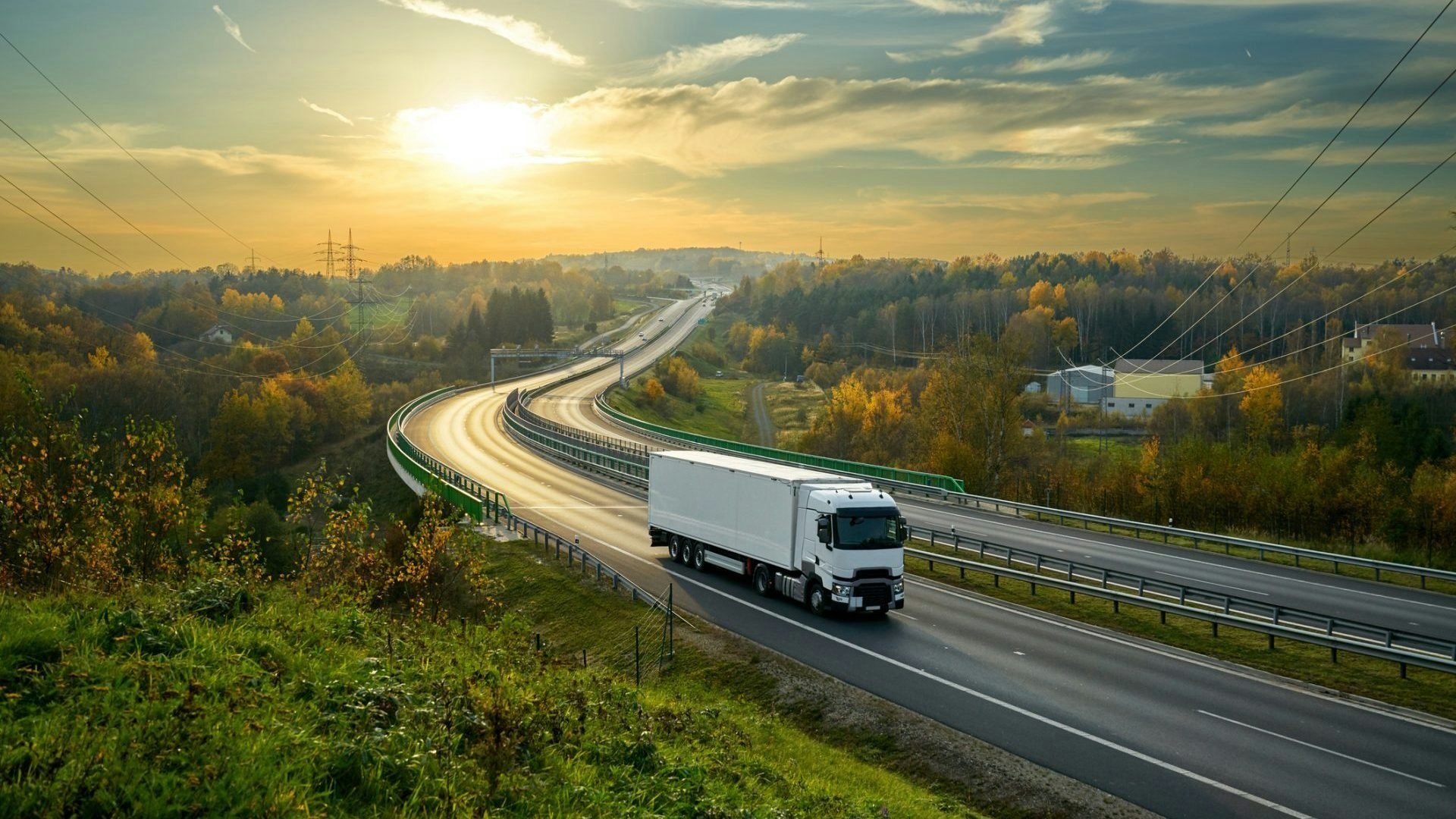 A truck going down a road as cover image
